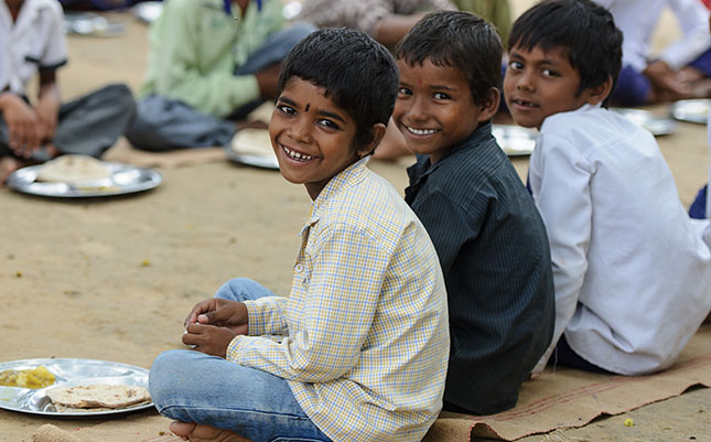 Children at Mahadev Primary School enjoy a school meal, prepared using clean, safe water.